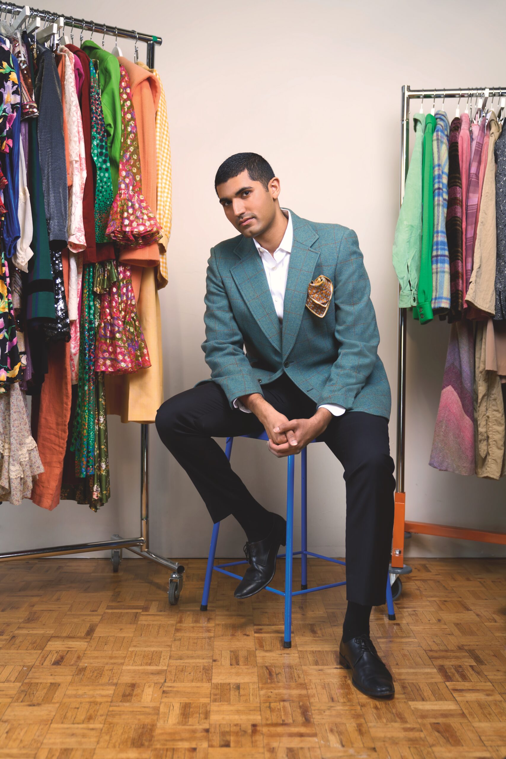 Nofil Nadeem’s ensemble features a green sport coat purchased from Papa Love Vintage, a Banana Republic dress shirt, Ralph Lauren trousers and vintage oxford shoes that he bought in Pakistan. The scarf in his pocket, supplied by Nouveau Riche Vintage, adds a bit of extra colour to the outfit.