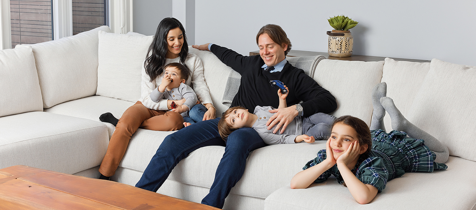 Stefanie Holland and family relaxing on the couch