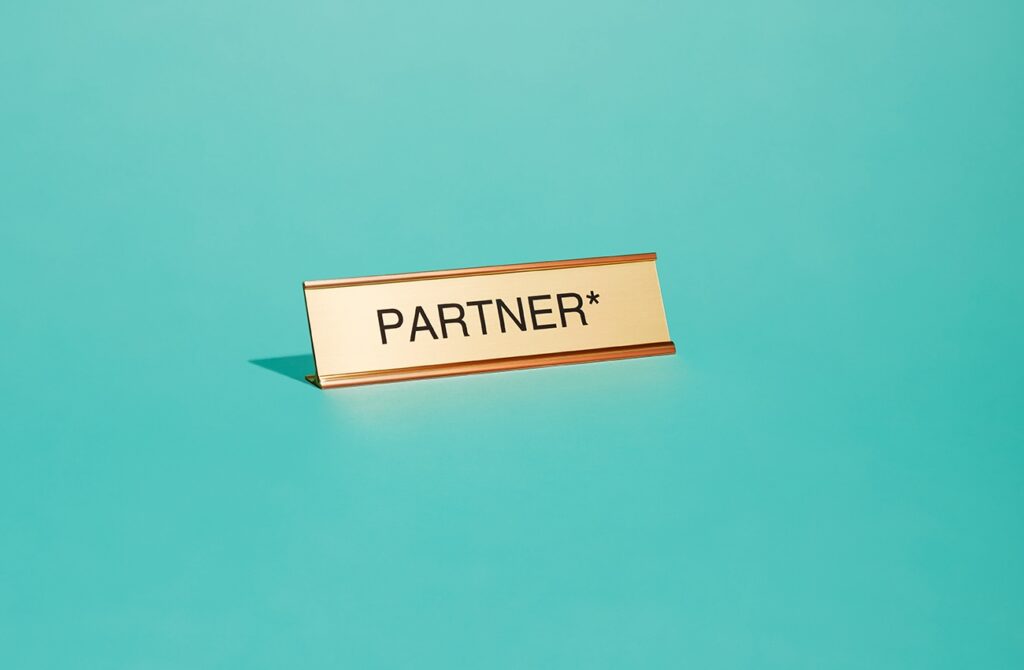 Name plate which reads: "Partner*"