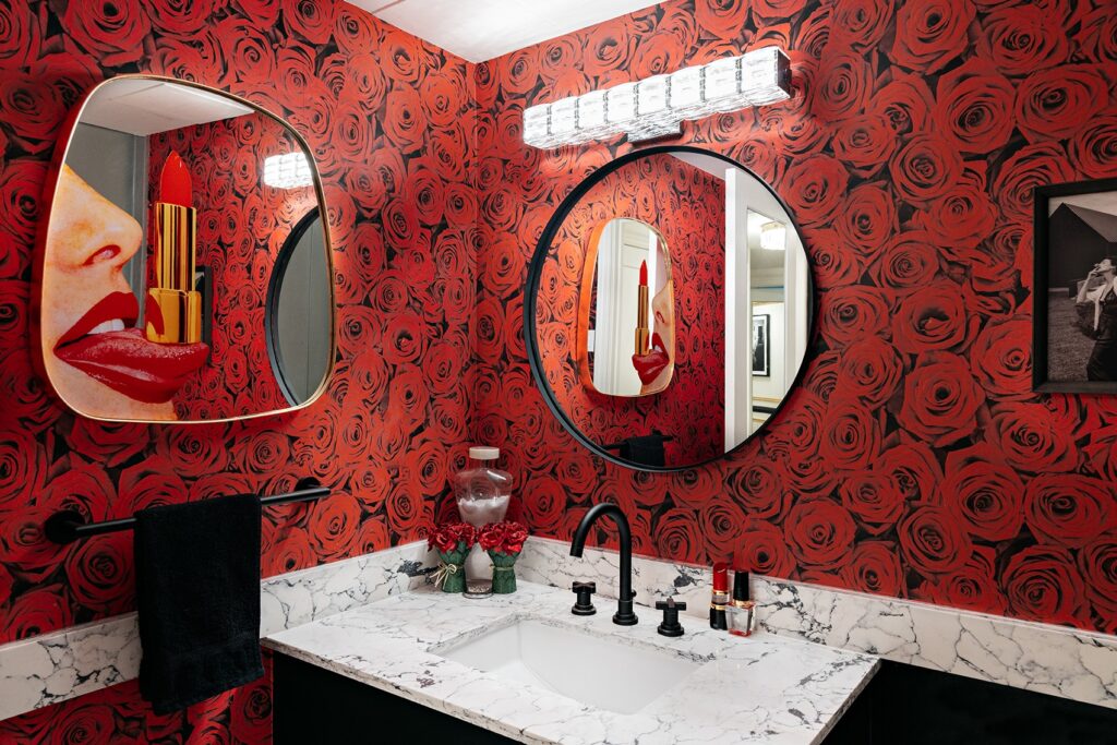 Leila Rafi's powder room featuring rose-print wallpaper