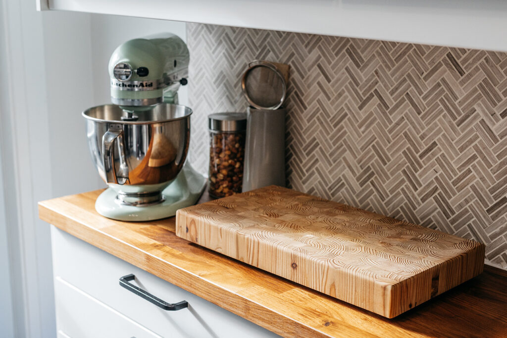 Zoë Hountalas and Justin Martin’s Kitchen Aid stand mixer and cutting board