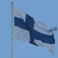 Finnish_flag_with_pole_on_independence_day_2011